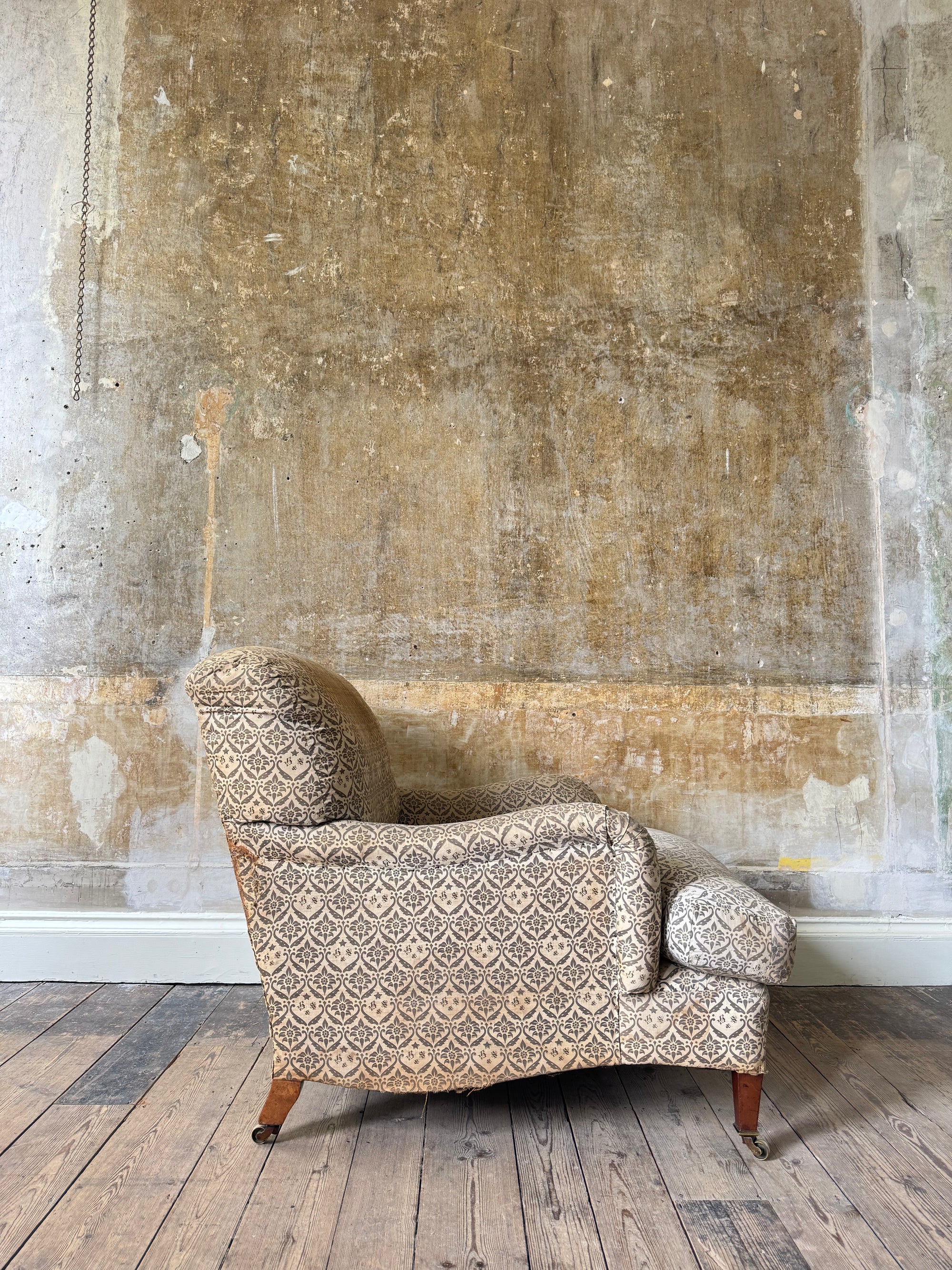A late 19th Century Howard & Sons Harley Armchair