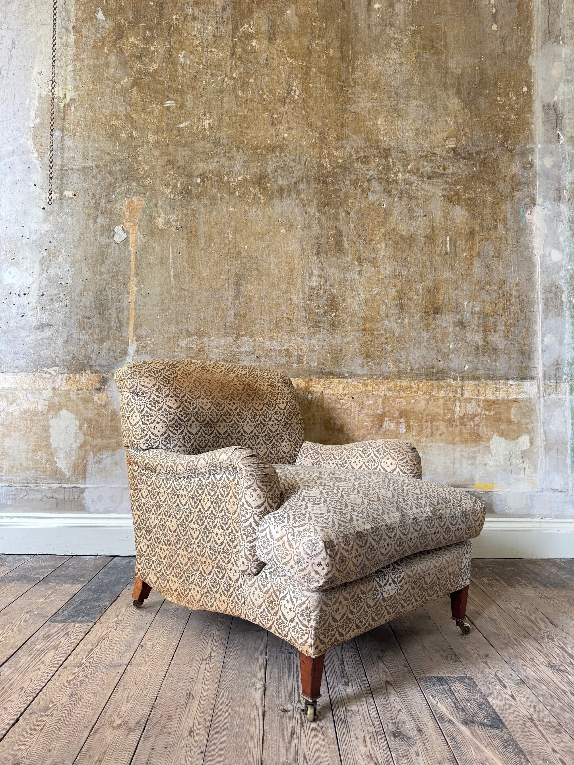A late 19th Century Howard & Sons Harley Armchair
