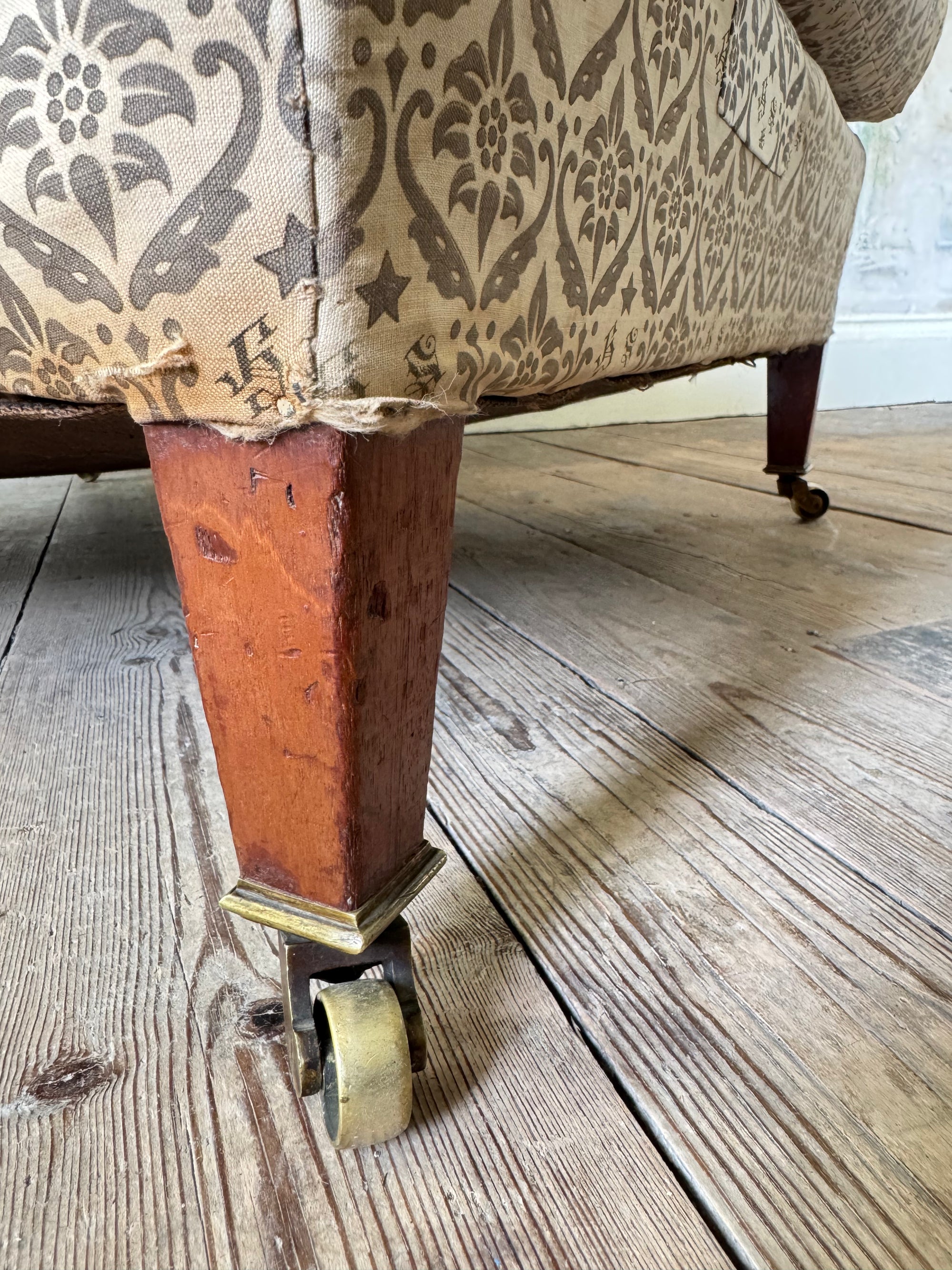 A late 19th Century Howard & Sons Harley Armchair