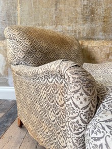 A late 19th Century Howard & Sons Harley Armchair