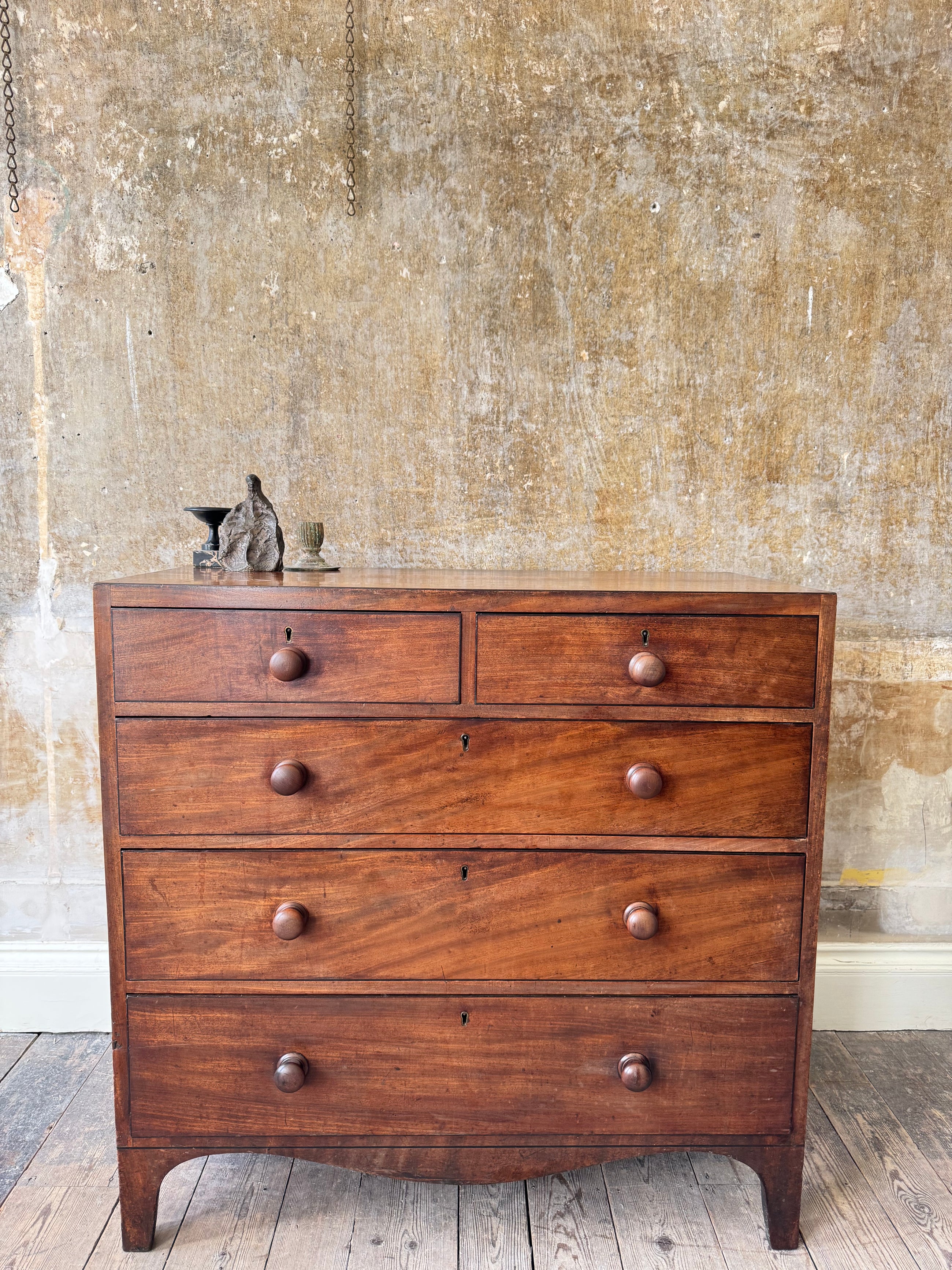 A George III Caddy-Topped Mahogany Chest Of Drawers
