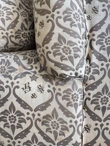 A late 19th Century Howard & Sons Harley Armchair