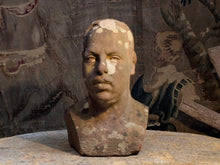 A Carved Stone Male Bust