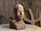 A Carved Stone Male Bust