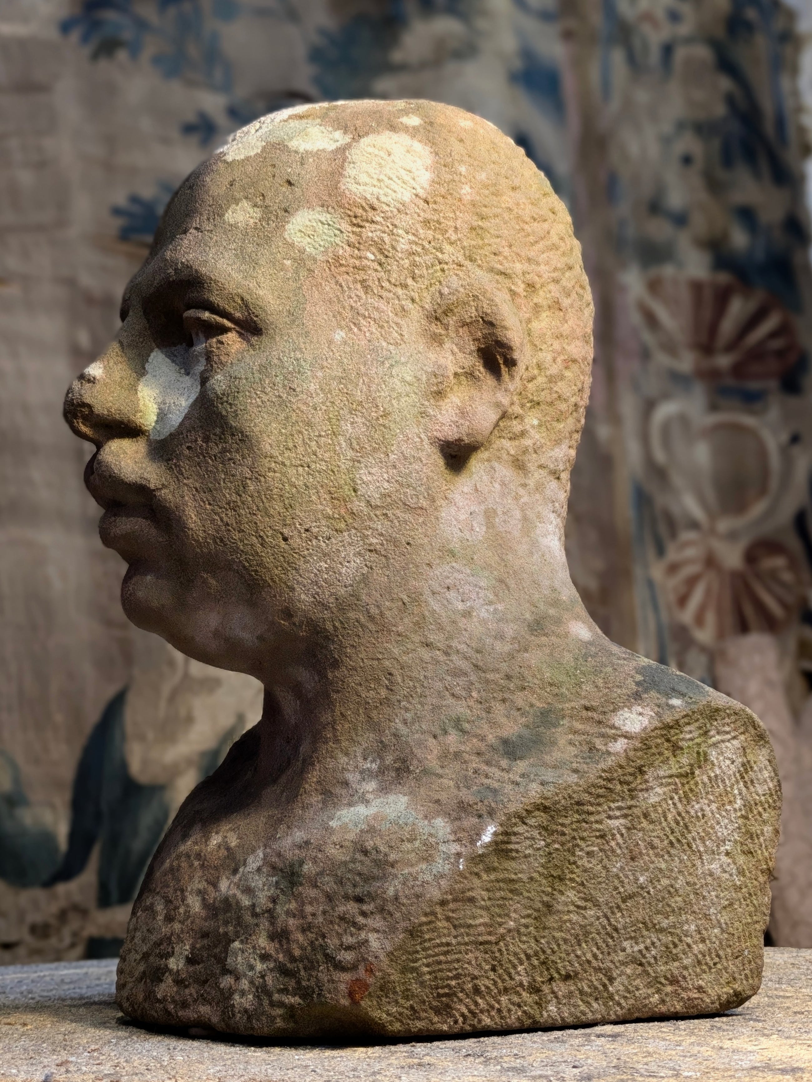 A Carved Stone Male Bust