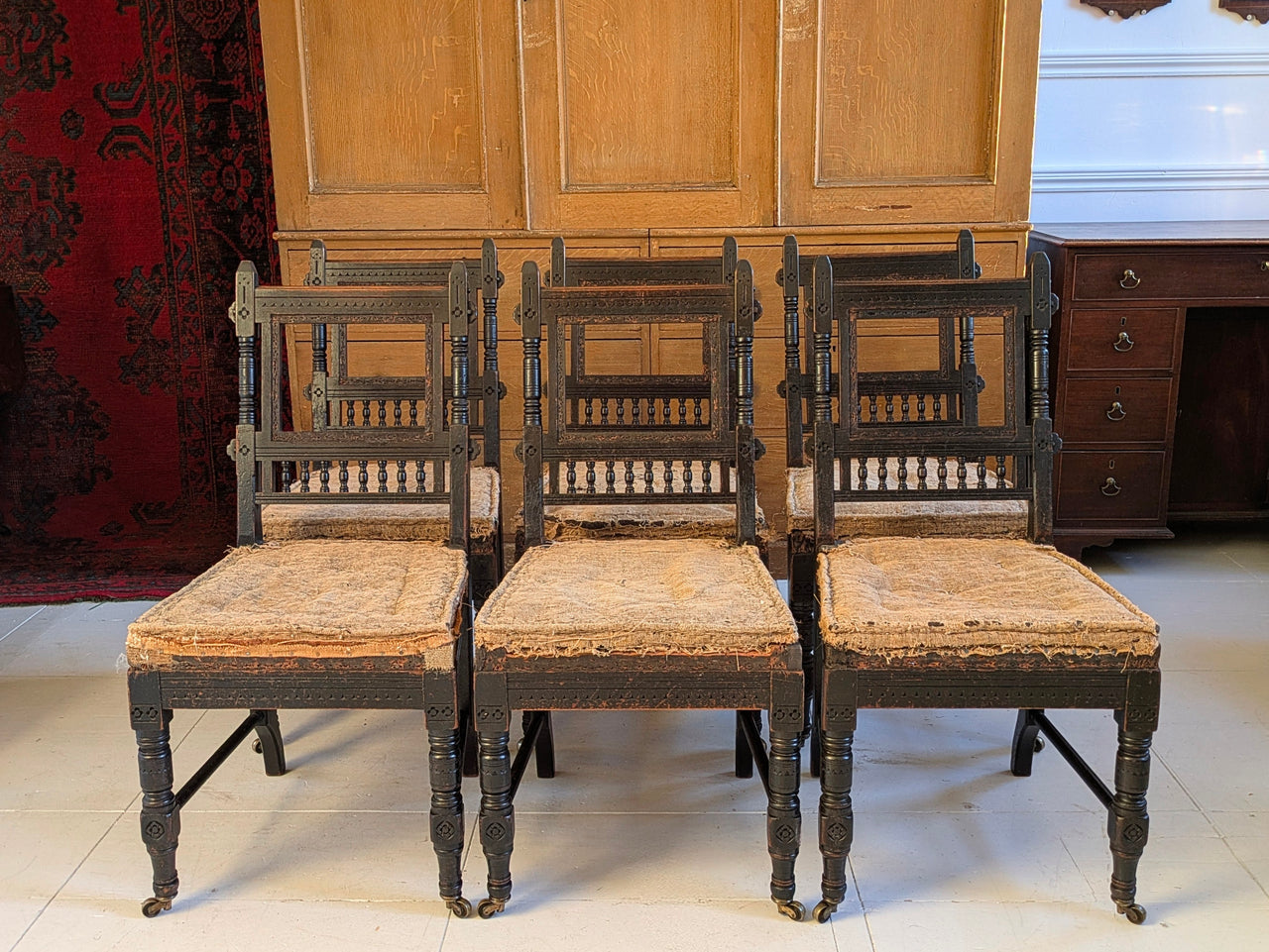 Six Ebonised Gothic Revival Dining Chairs