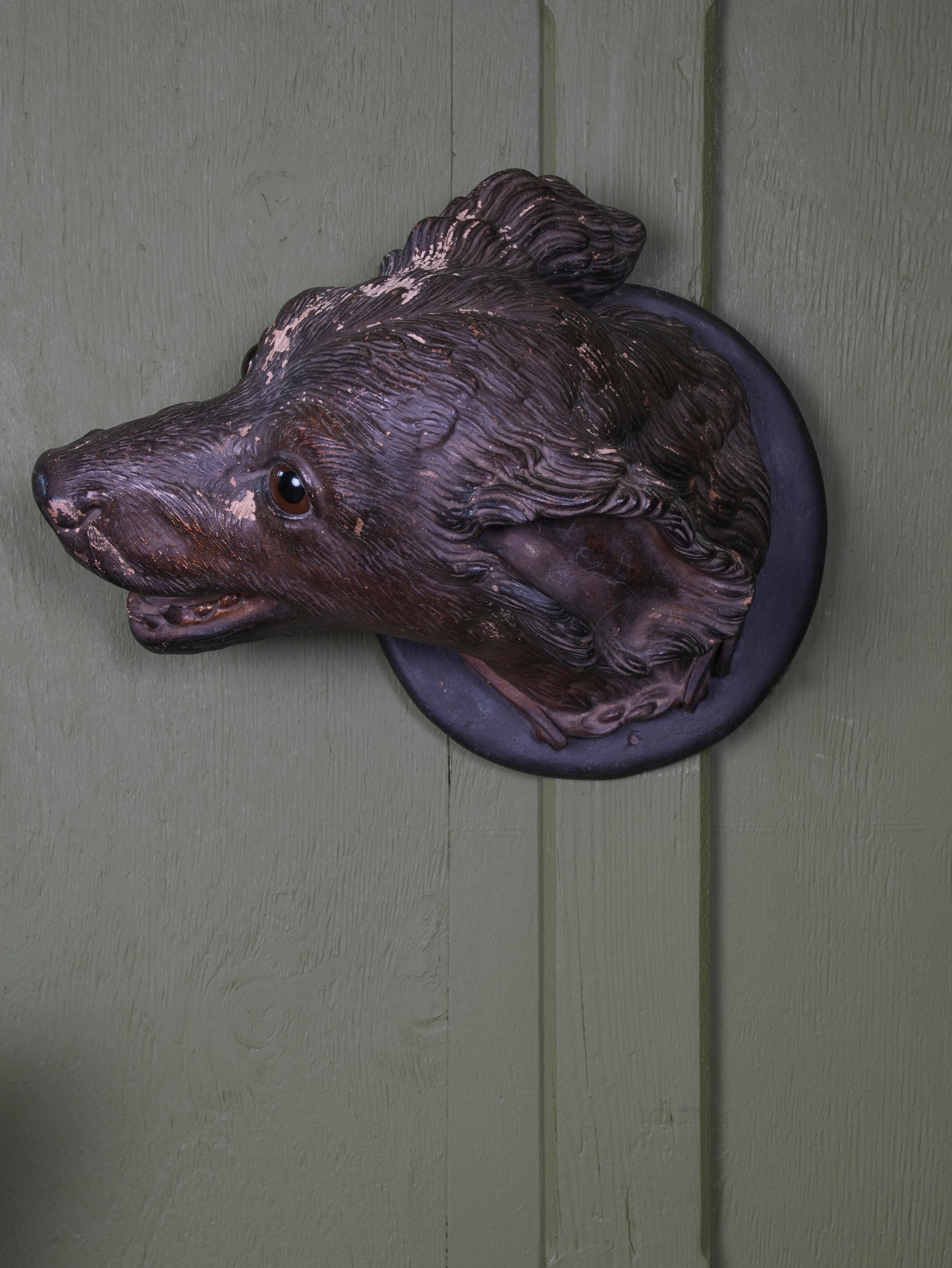 An Austrian Terracotta Dogs Head Mount