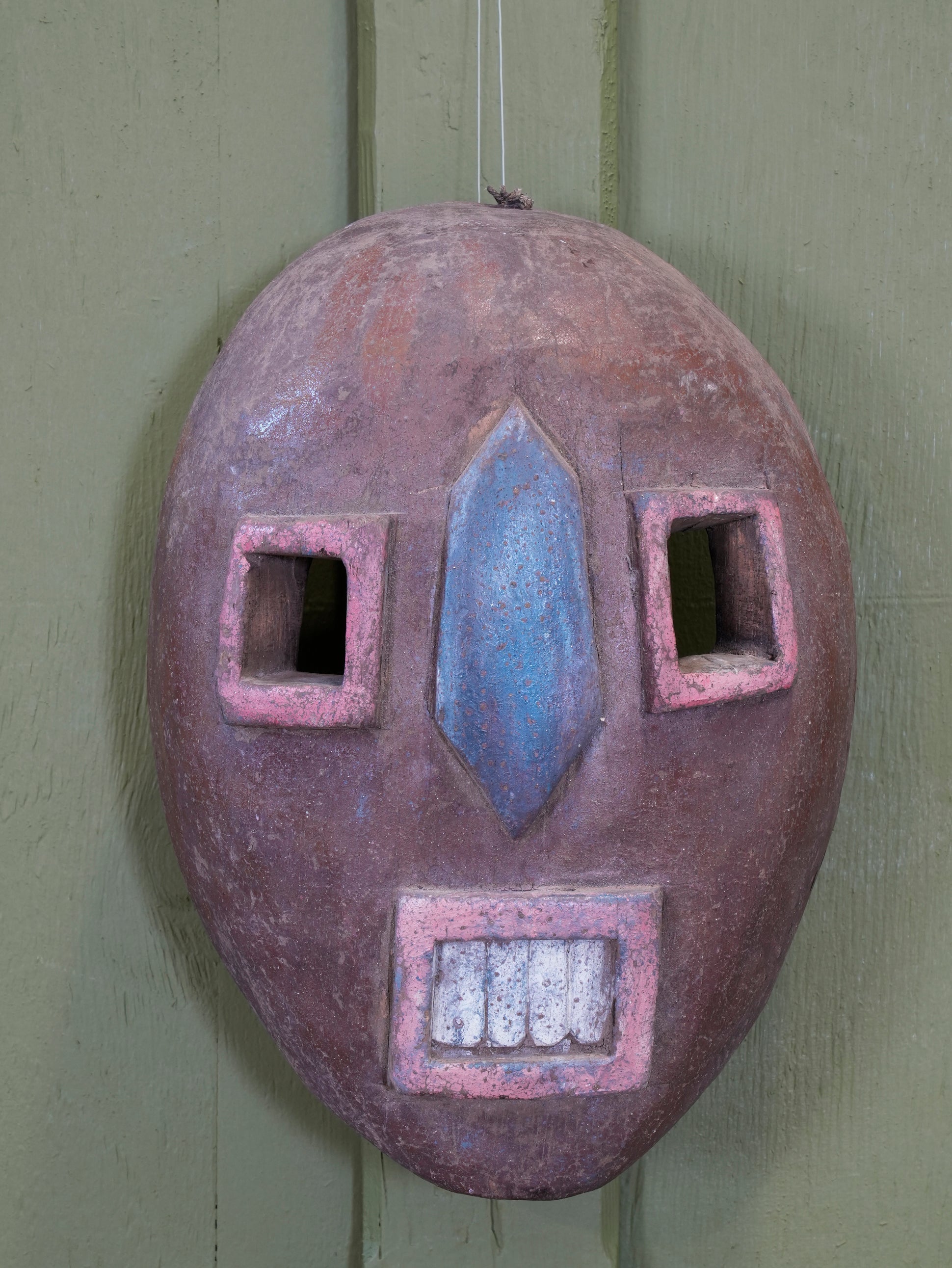An African Kumu Face Mask
