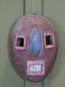 An African Kumu Face Mask