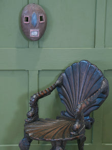 An African Kumu Face Mask