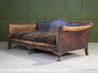 A Large Leather Camelback Sofa