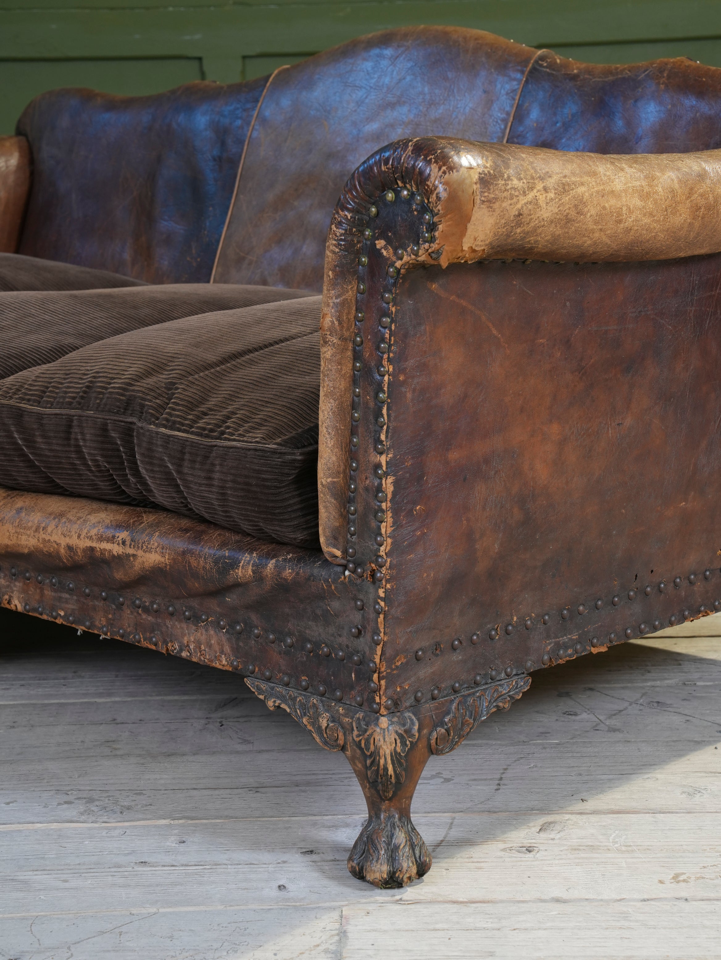 A Large Leather Camelback Sofa