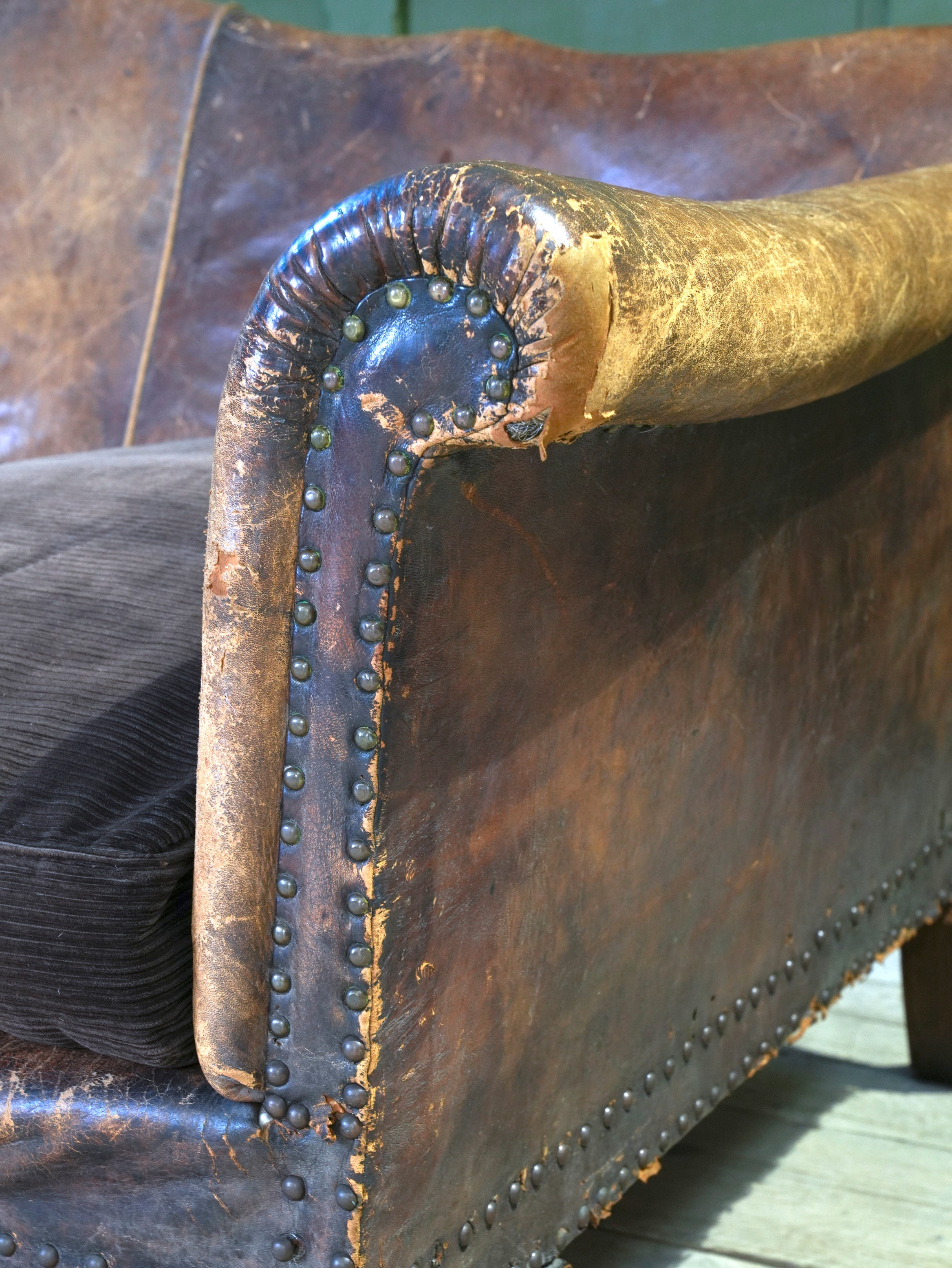 A Large Leather Camelback Sofa