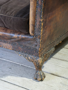A Large Leather Camelback Sofa