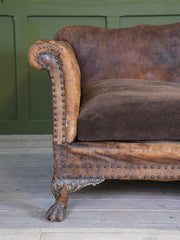 A Large Leather Camelback Sofa