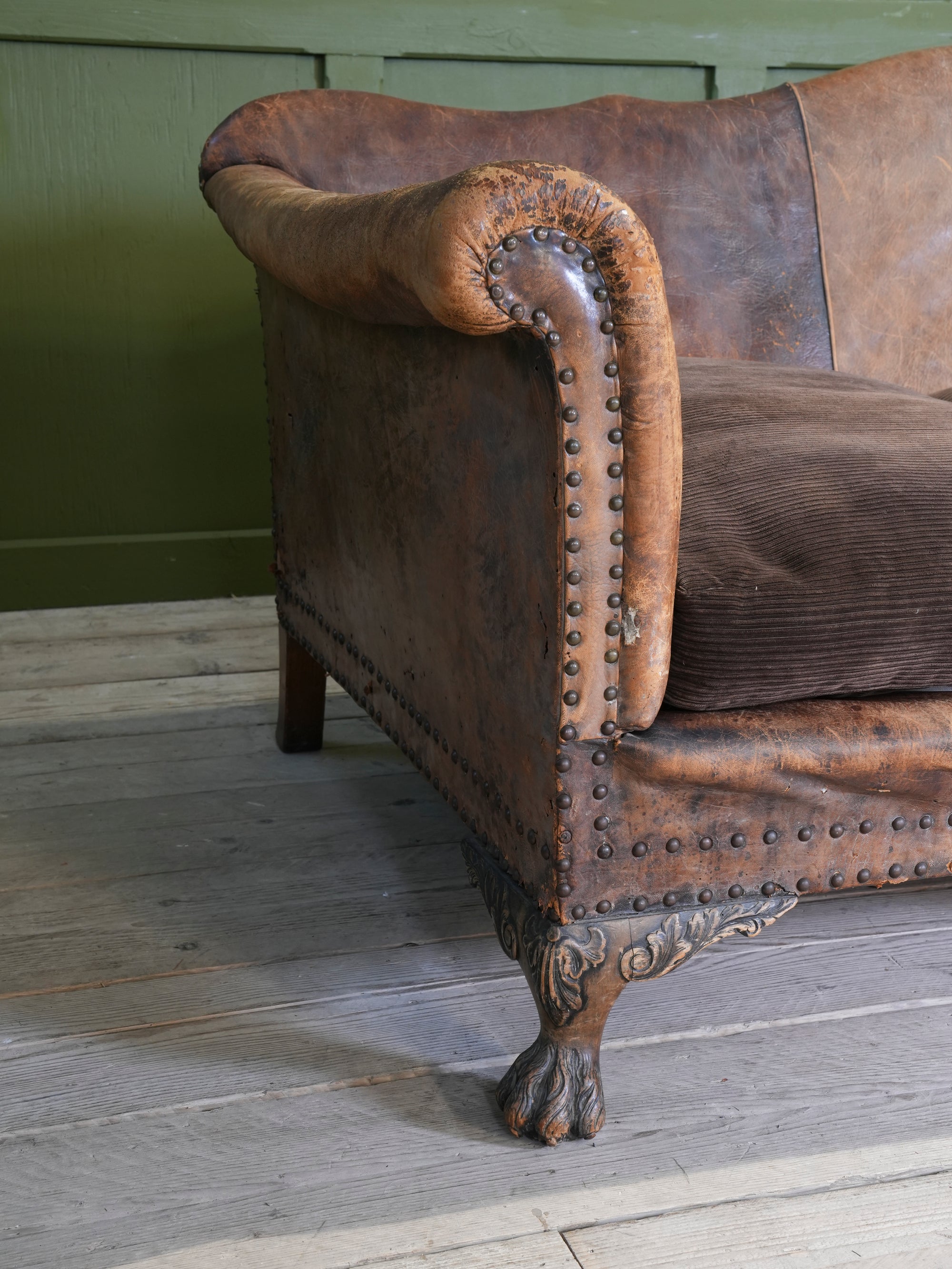 A Large Leather Camelback Sofa