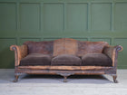 A Large Leather Camelback Sofa
