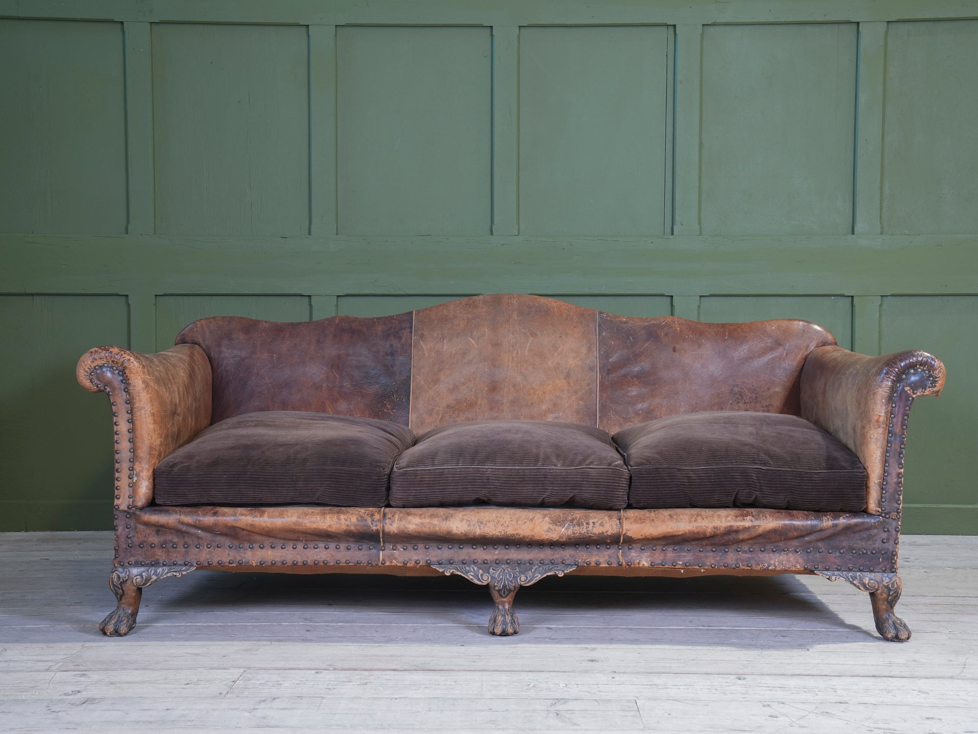A Large Leather Camelback Sofa