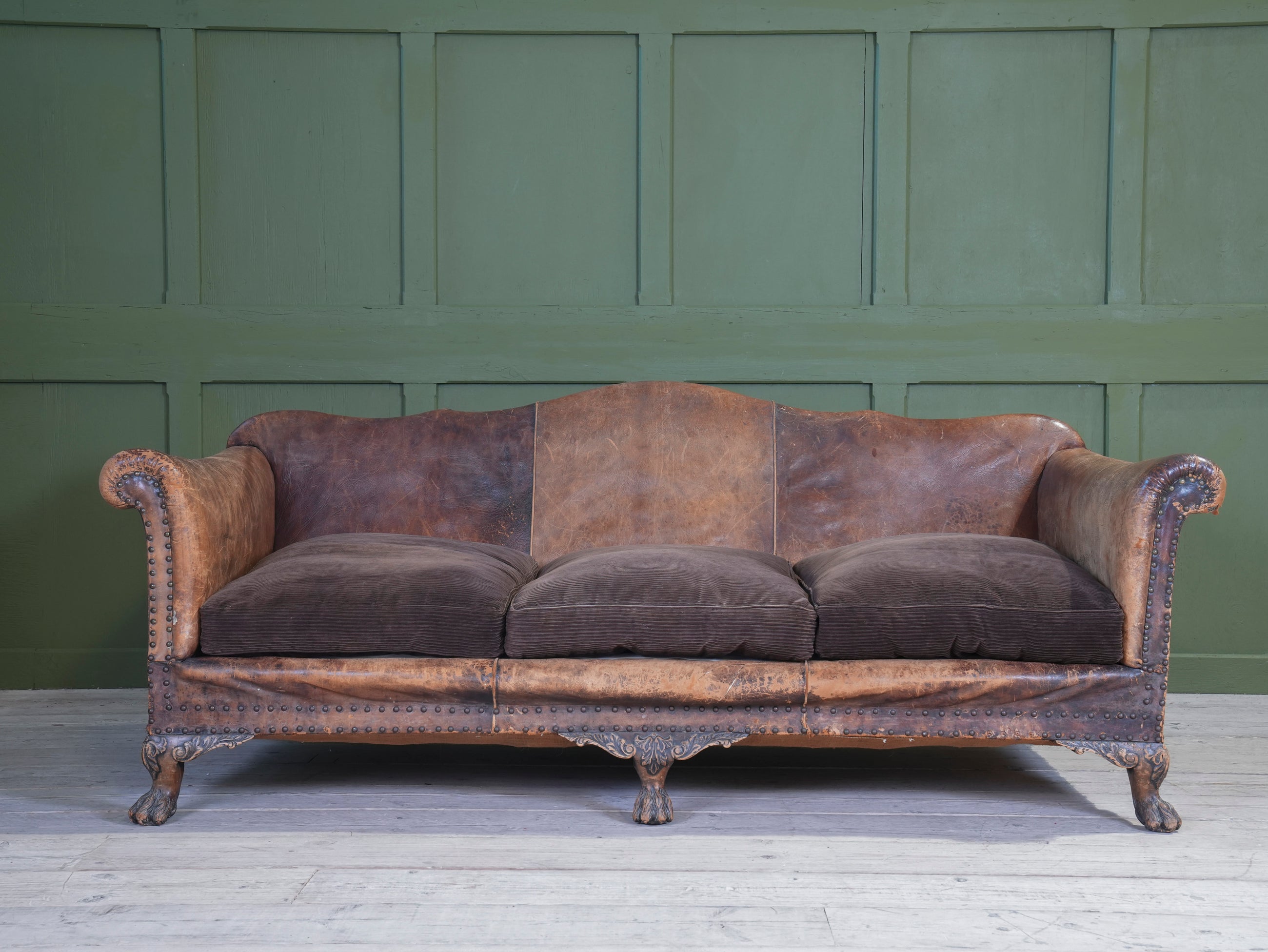 A Large Leather Camelback Sofa