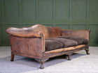 A Large Leather Camelback Sofa