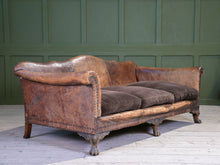 A Large Leather Camelback Sofa