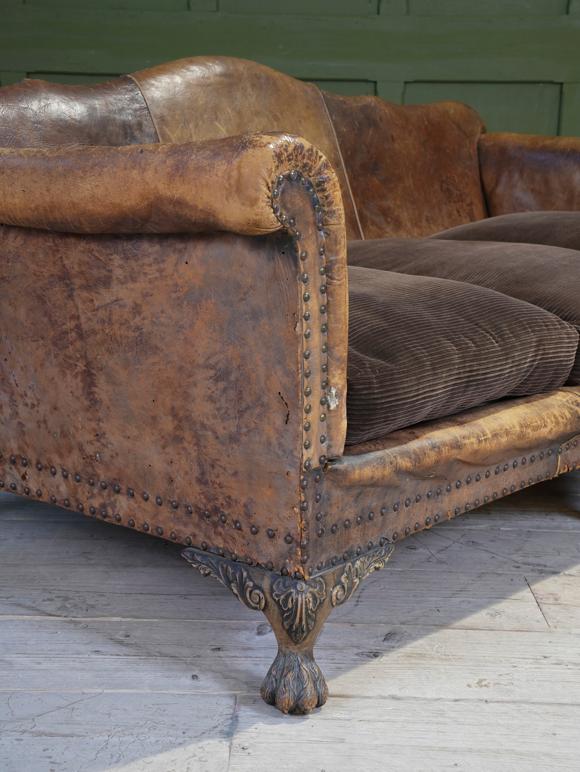 A Large Leather Camelback Sofa