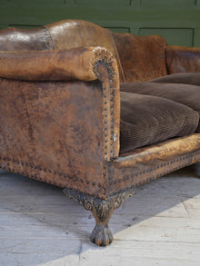 A Large Leather Camelback Sofa