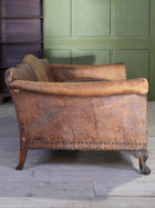 A Large Leather Camelback Sofa