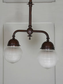 A Twin Holophane Ceiling Light