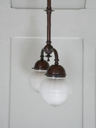 A Twin Holophane Ceiling Light