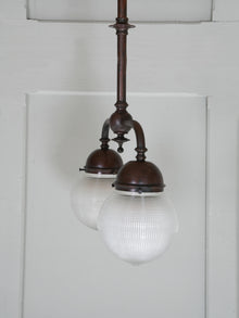 A Twin Holophane Ceiling Light
