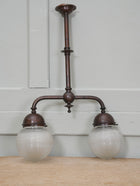 A Twin Holophane Ceiling Light