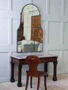 A Domed Top Mirror in a Reeded Timber frame