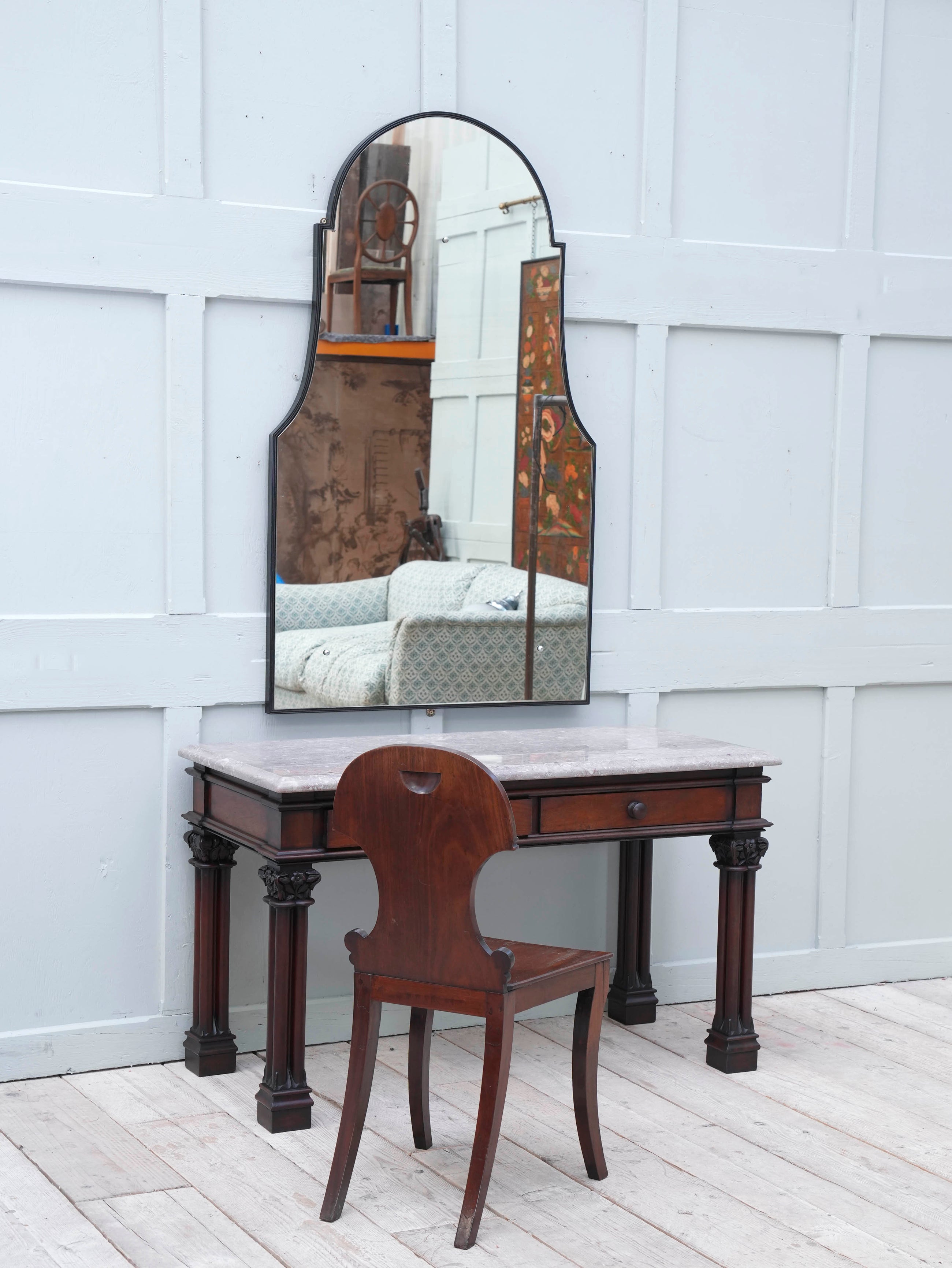 A Domed Top Mirror in a Reeded Timber frame