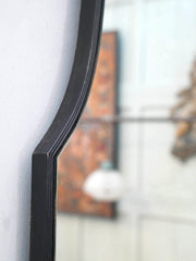 A Domed Top Mirror in a Reeded Timber frame