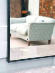 A Domed Top Mirror in a Reeded Timber frame