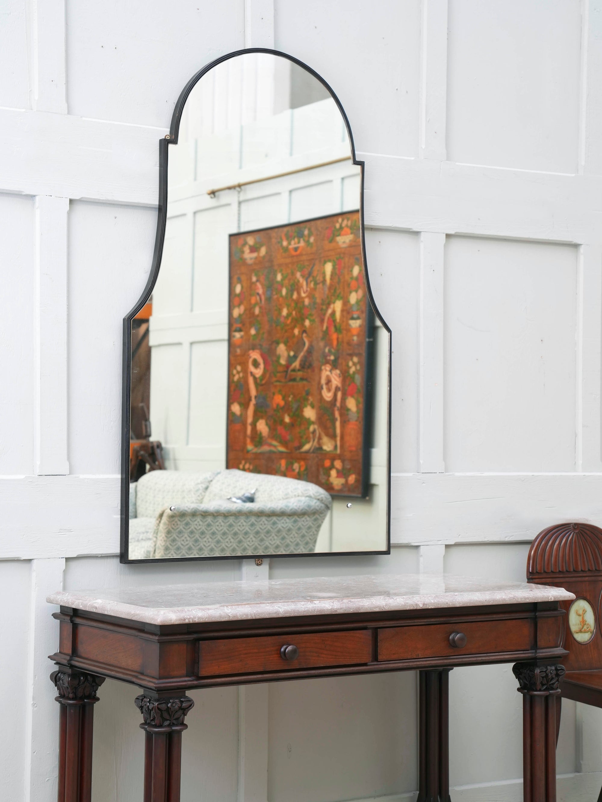 A Domed Top Mirror in a Reeded Timber frame