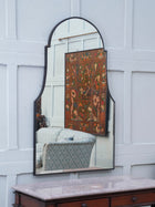 A Domed Top Mirror in a Reeded Timber frame