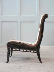 An Ebonised Aesthetic Movement Upholstered Chair