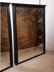 A Pair of Ebonised Mirrors