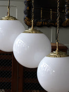 The Tomkin Opaline Glass Pendant in Polished Brass