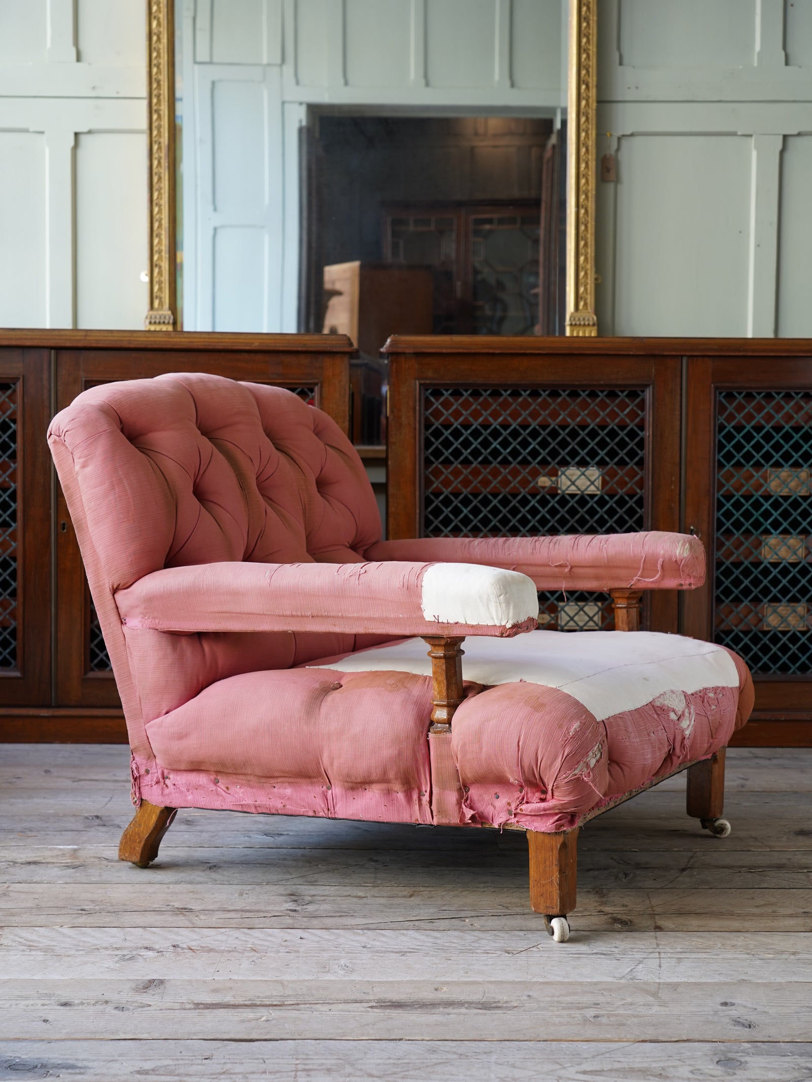 A large 19th Century Open ArmChair