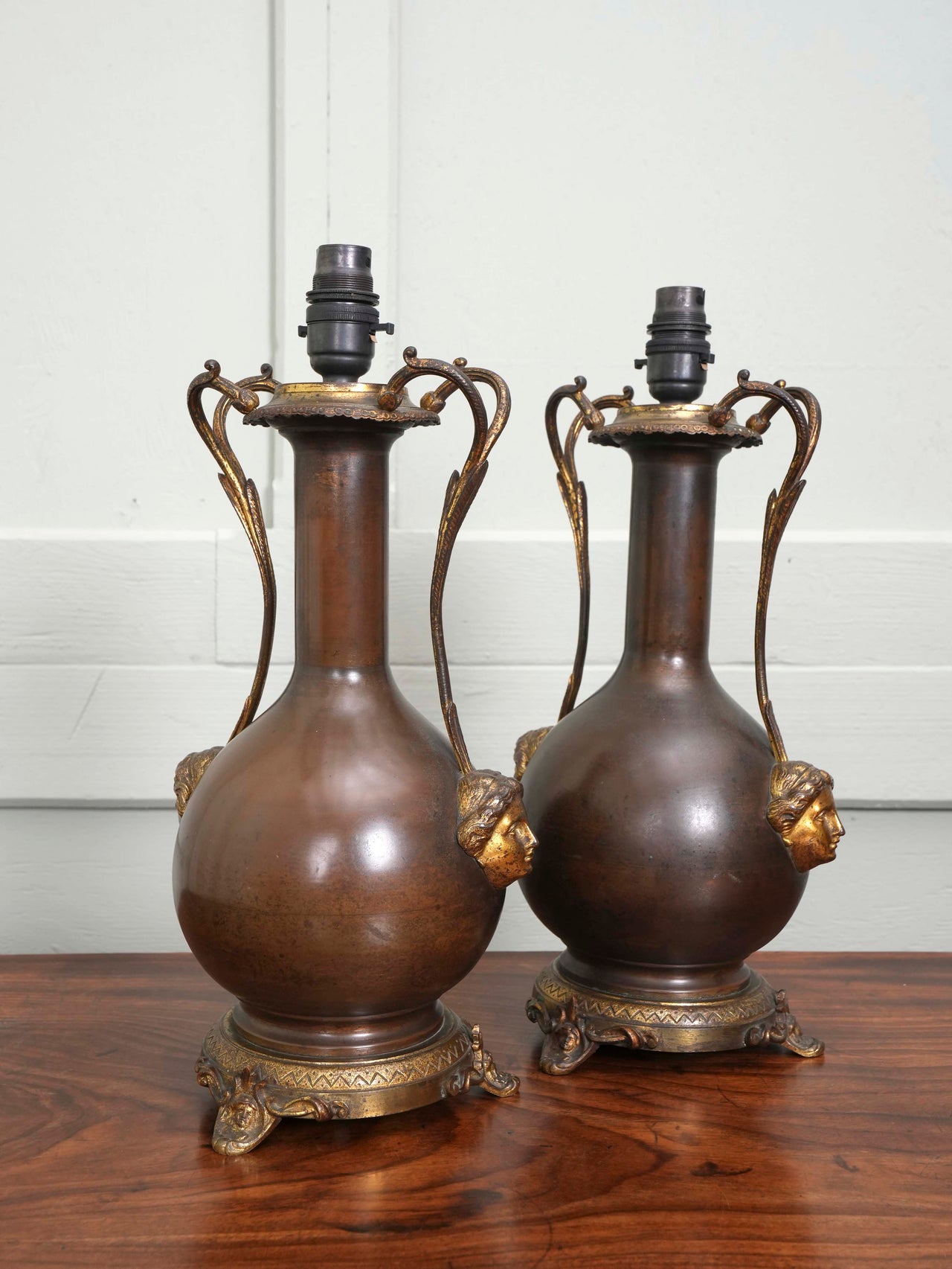 A Pair of Twin Handled Copper Vase Table Lamps