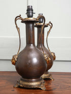 A Pair of Twin Handled Copper Vase Table Lamps