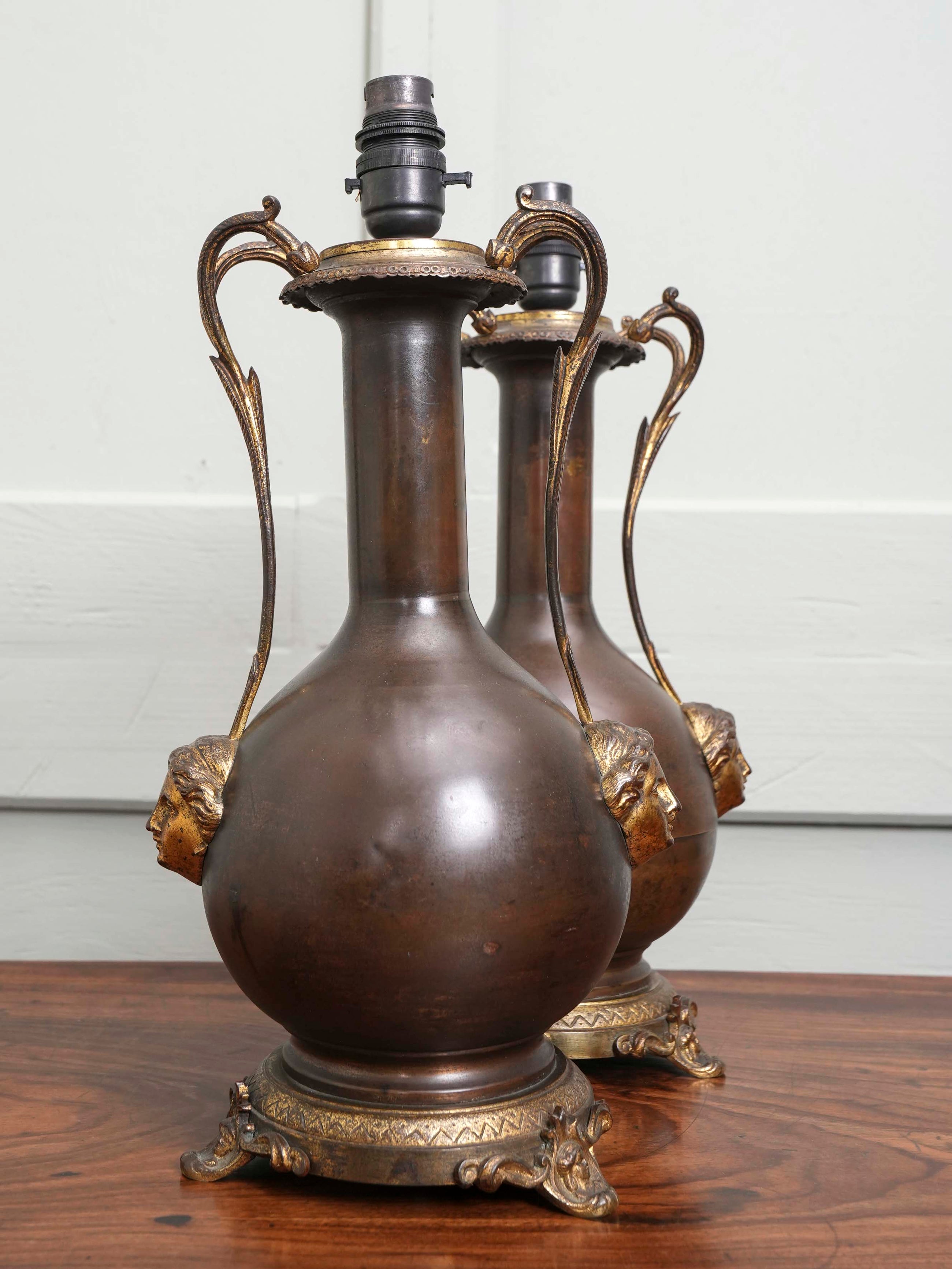 A Pair of Twin Handled Copper Vase Table Lamps