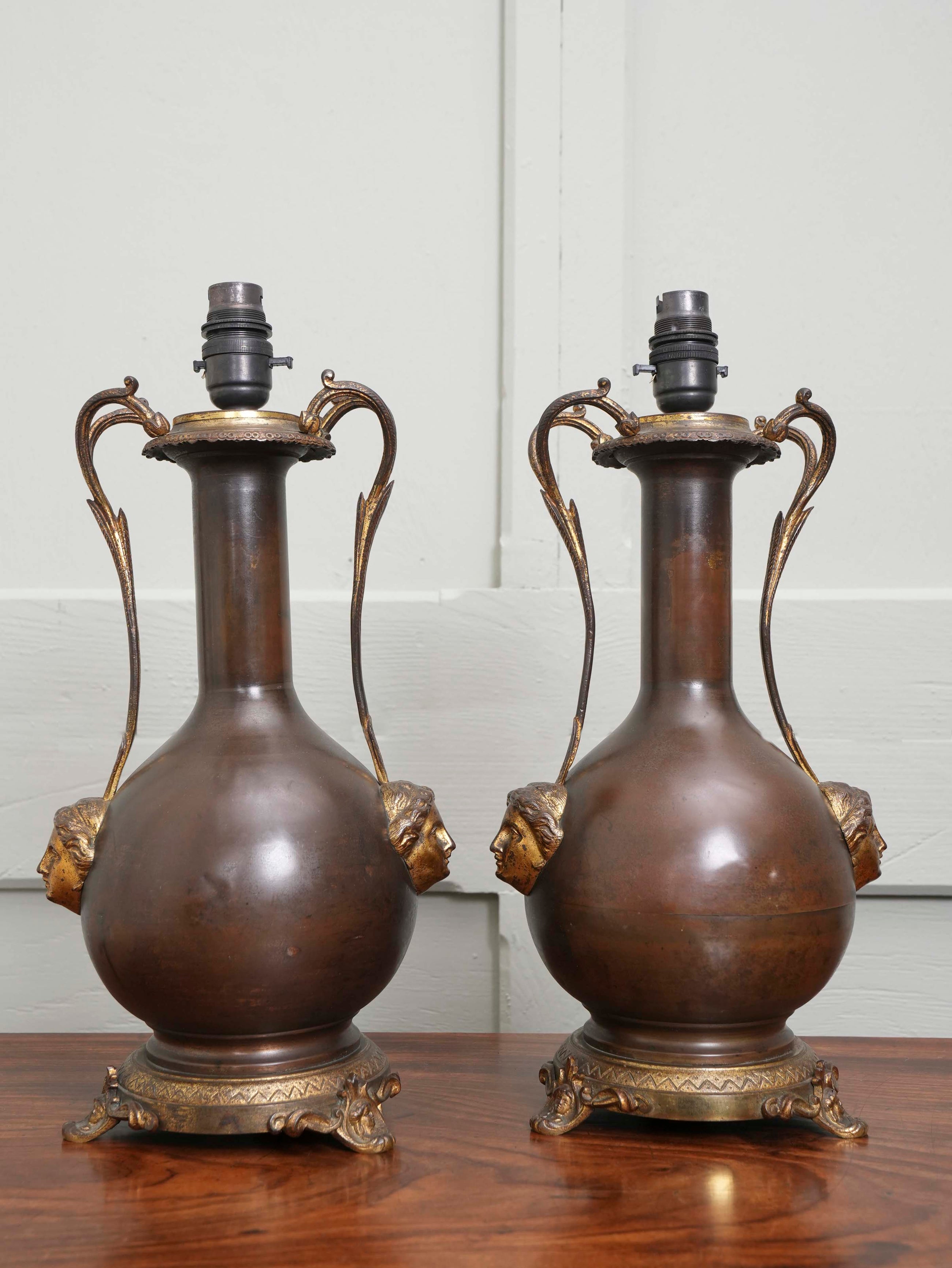 A Pair of Twin Handled Copper Vase Table Lamps