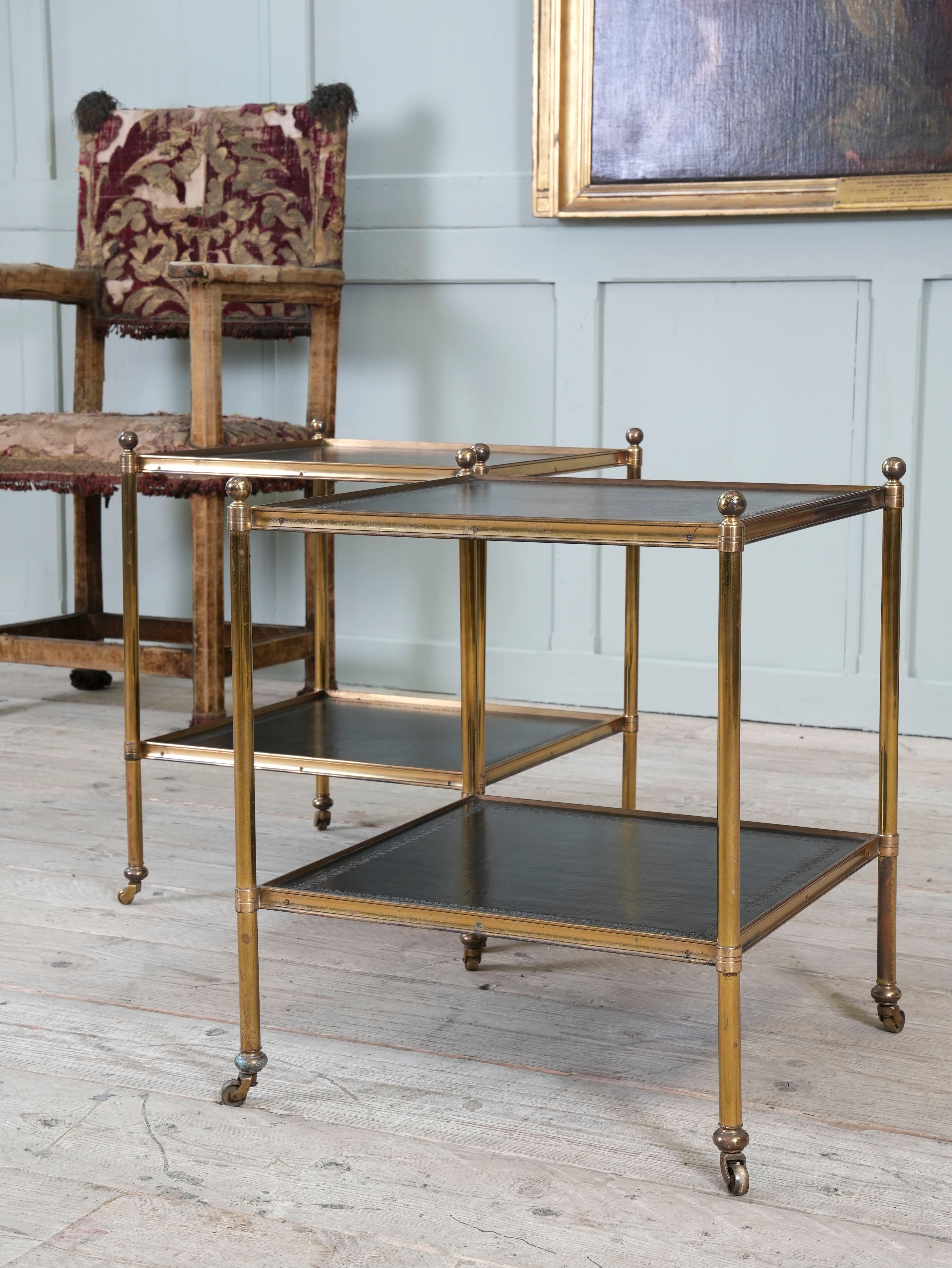 A Pair of Brass and Leather Side Tables