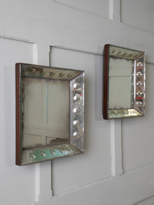 A Pair of Bevelled Wall Mirrors