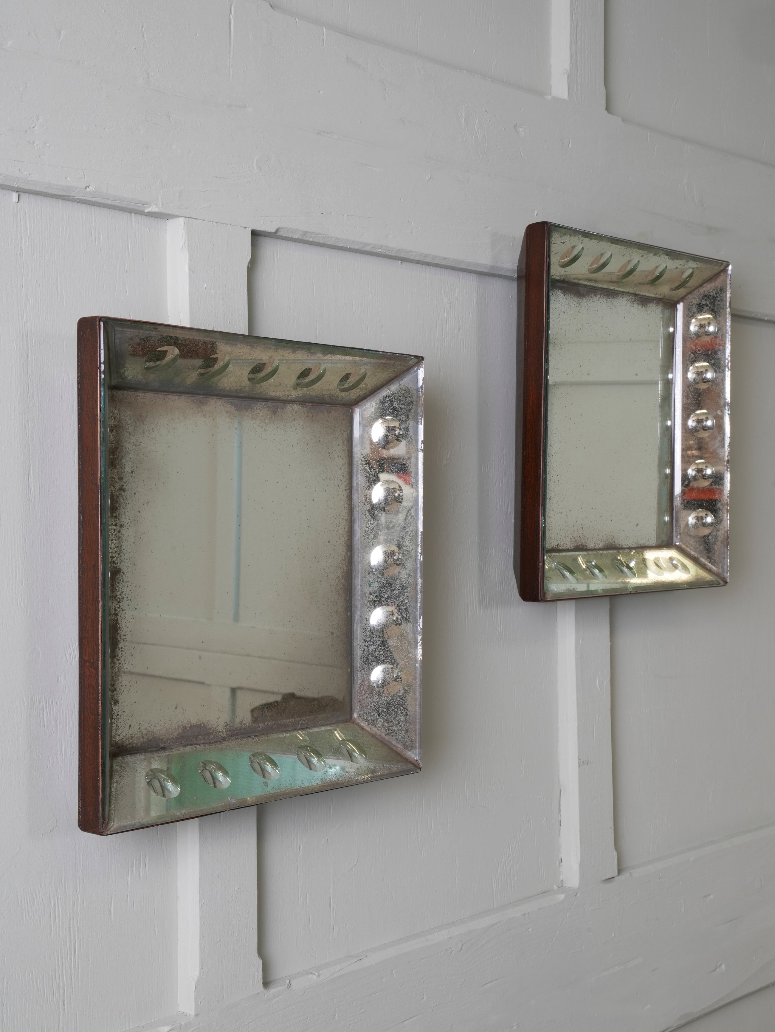 A Pair of Bevelled Wall Mirrors