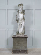 A Carved Stone Standing Male Figure with Crown